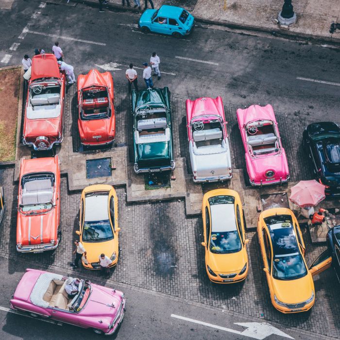 overhead-shot-assorted-cars-different-colors-parking-lot